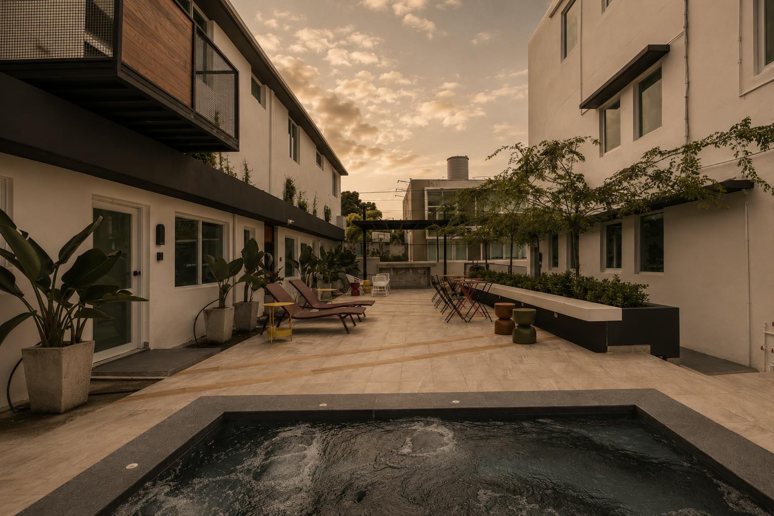 The courtyard and pool at Casa Placita Hotel in Old San Juan at dusk